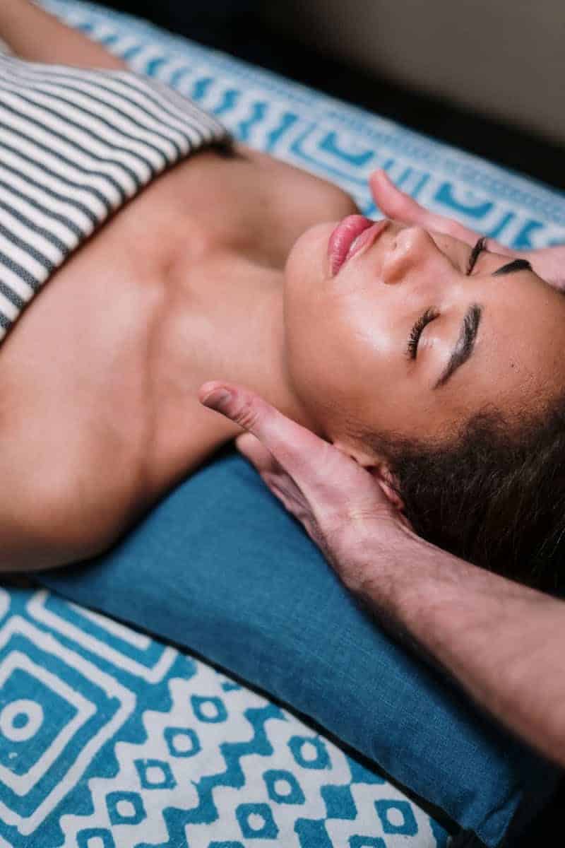 Woman Lying on Blue Textile